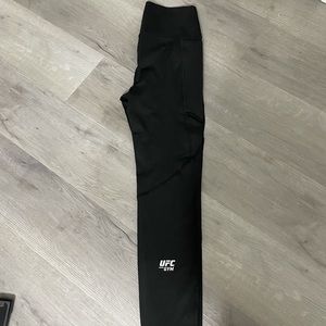 Black active wear leggings with logo at the bottom
